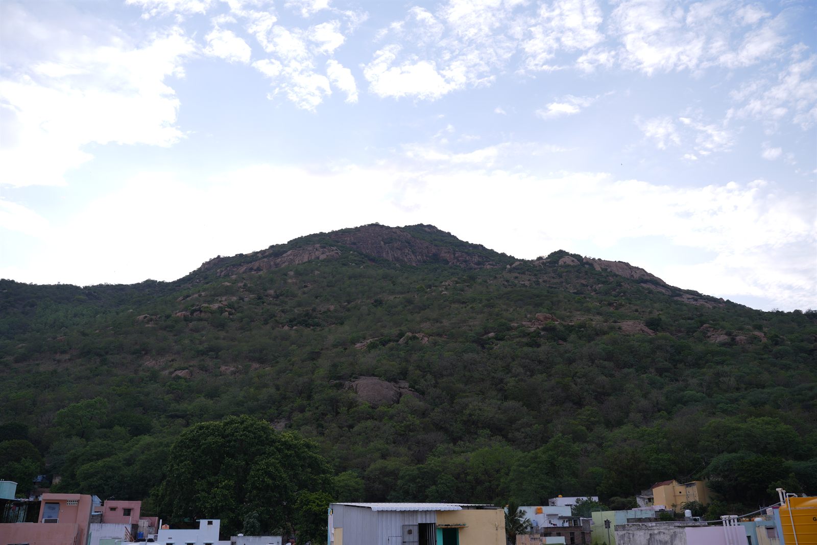 Arunachala hill seen above the colourful rooftops of Tiruvannamalai