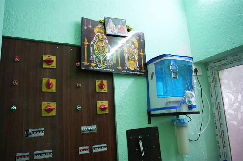 Common area with a wall-mounted RO water purifier